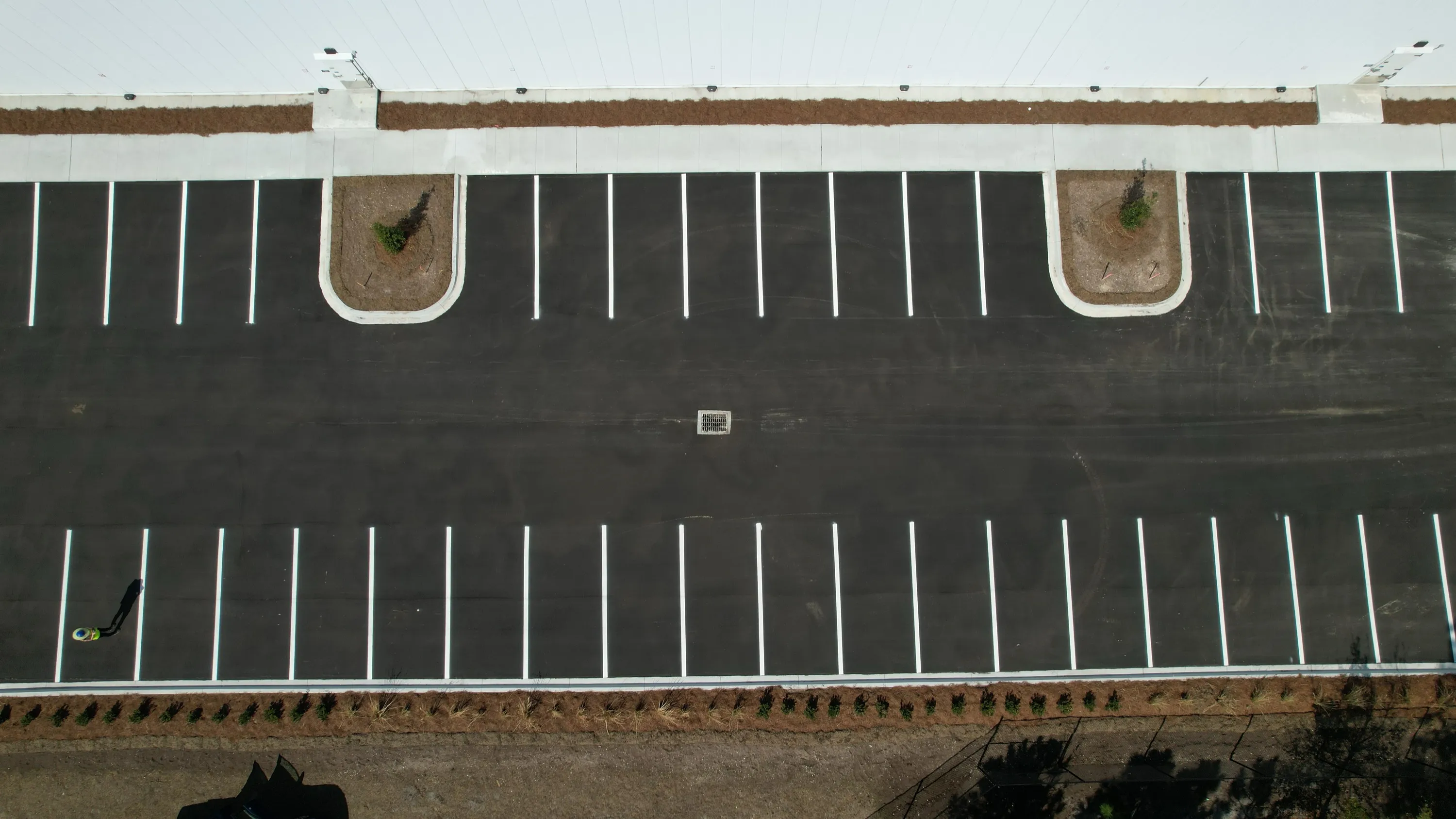 Aerial of a finished parking lot, freshly striped